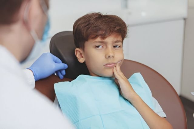 Emergency pediatric dental treatment in progress