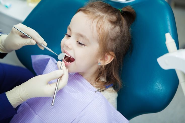 Severely decayed baby tooth requiring extraction